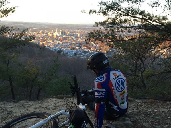 Biker sitting with on side Greater reading quarry overlook