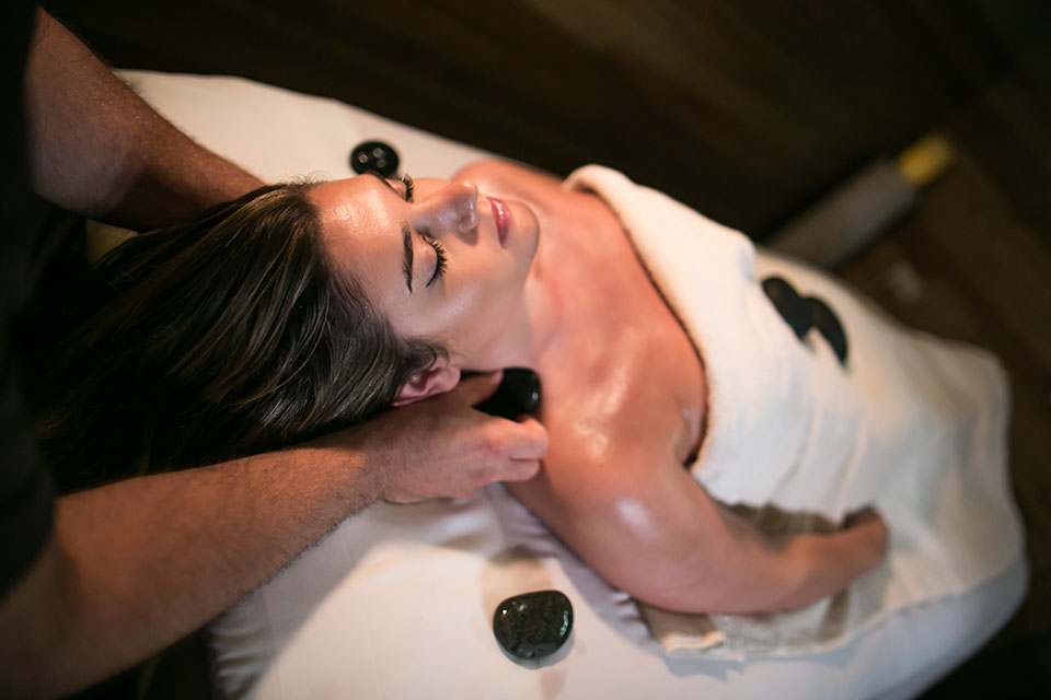 Women receiving hot stone massage